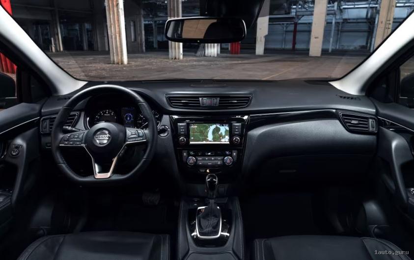 Інтер’єр Nissan Rogue T33 з передніми сидіннями, екраном і селектором